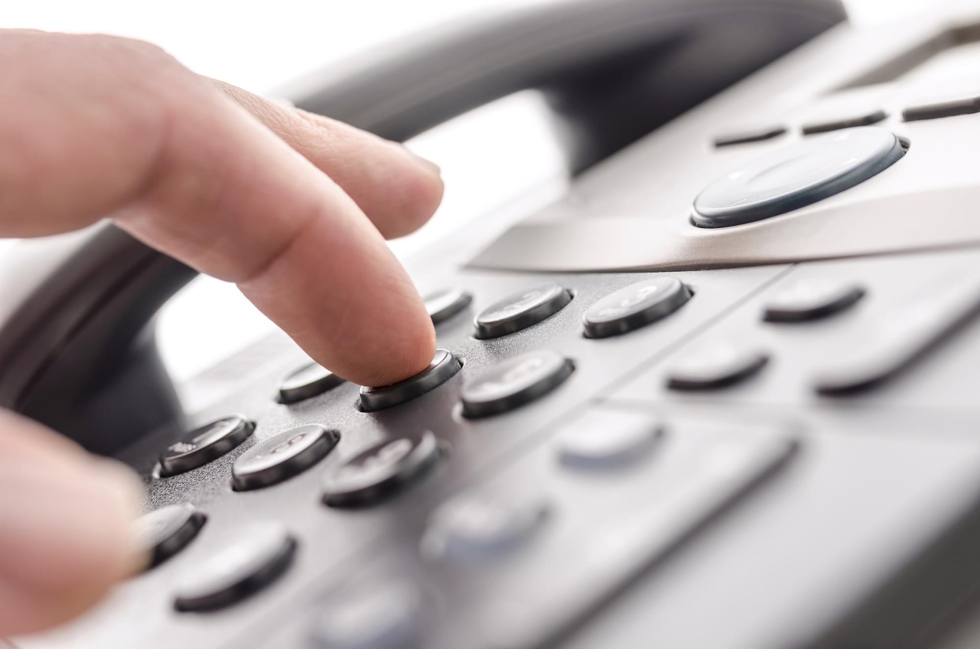 Detail of using a telephone keypad. Shallow dof.