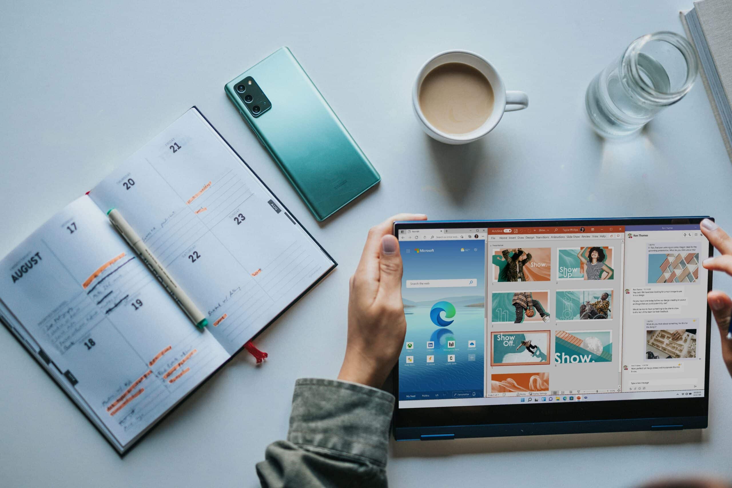 10-Tips-To-Get-The-Most-Out-Of-Your-Microsoft-365-Apps-scaled.jpg person using Windows 11 computer beside white ceramic mug on white table